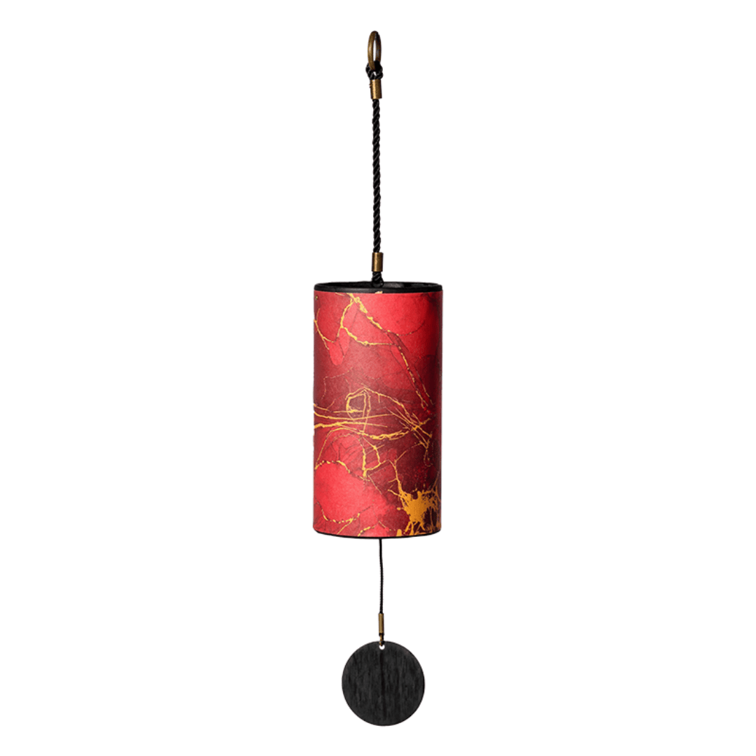 Red and gold marbled wind chime with black striker, healing musical instrument for peace and relaxation