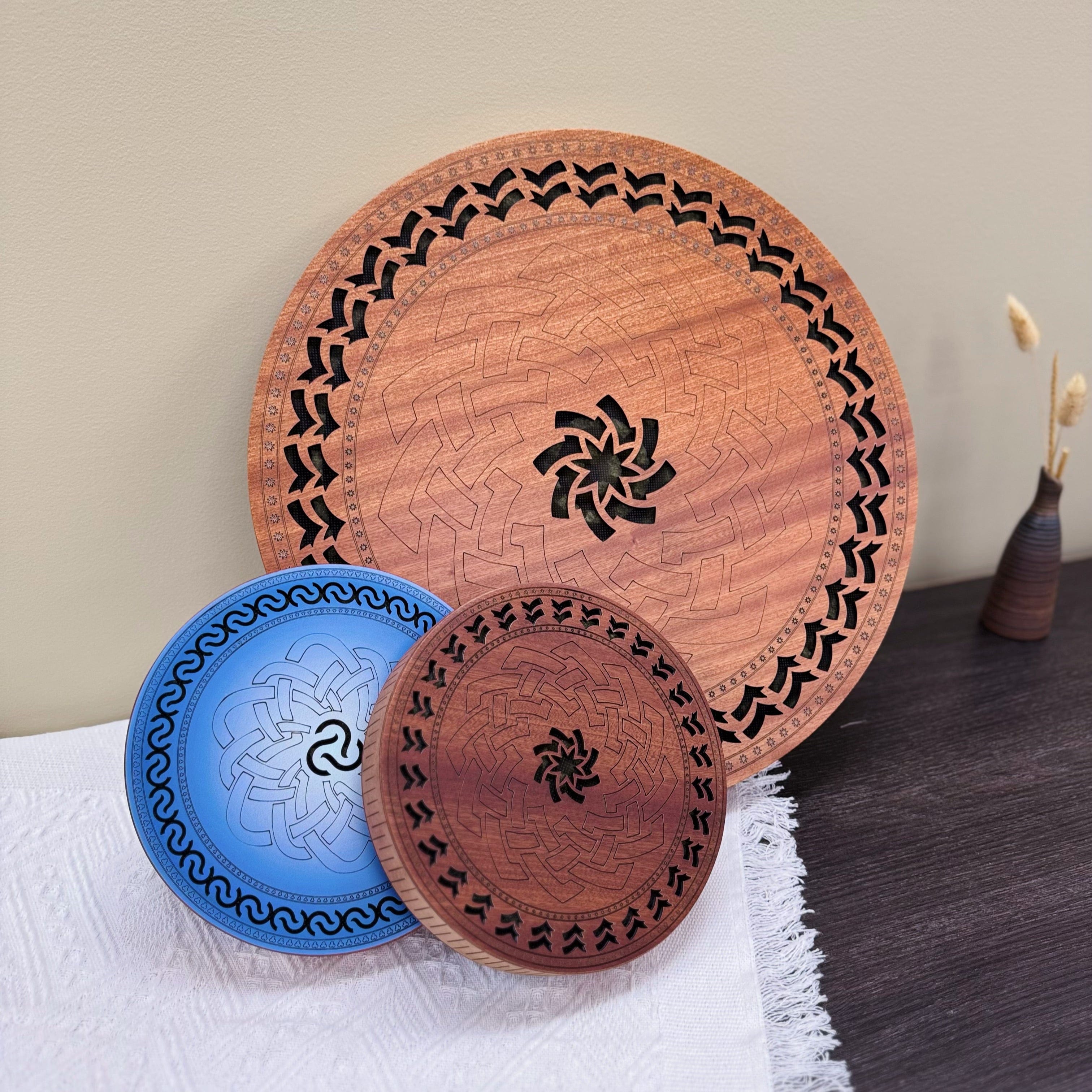 Handcrafted wooden tongue drums with intricate geometric and Celtic knot designs, ideal for meditation and healing sound therapy.