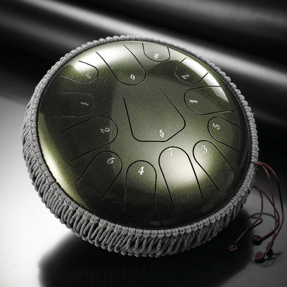 Green handpan drum with numbered notes and gray rope trim, ideal for meditation and healing sound therapy.