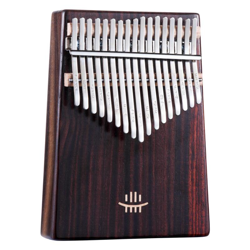 Handcrafted kalimba with rich wood grain and tuned metal tines, ideal for healing sound and meditation