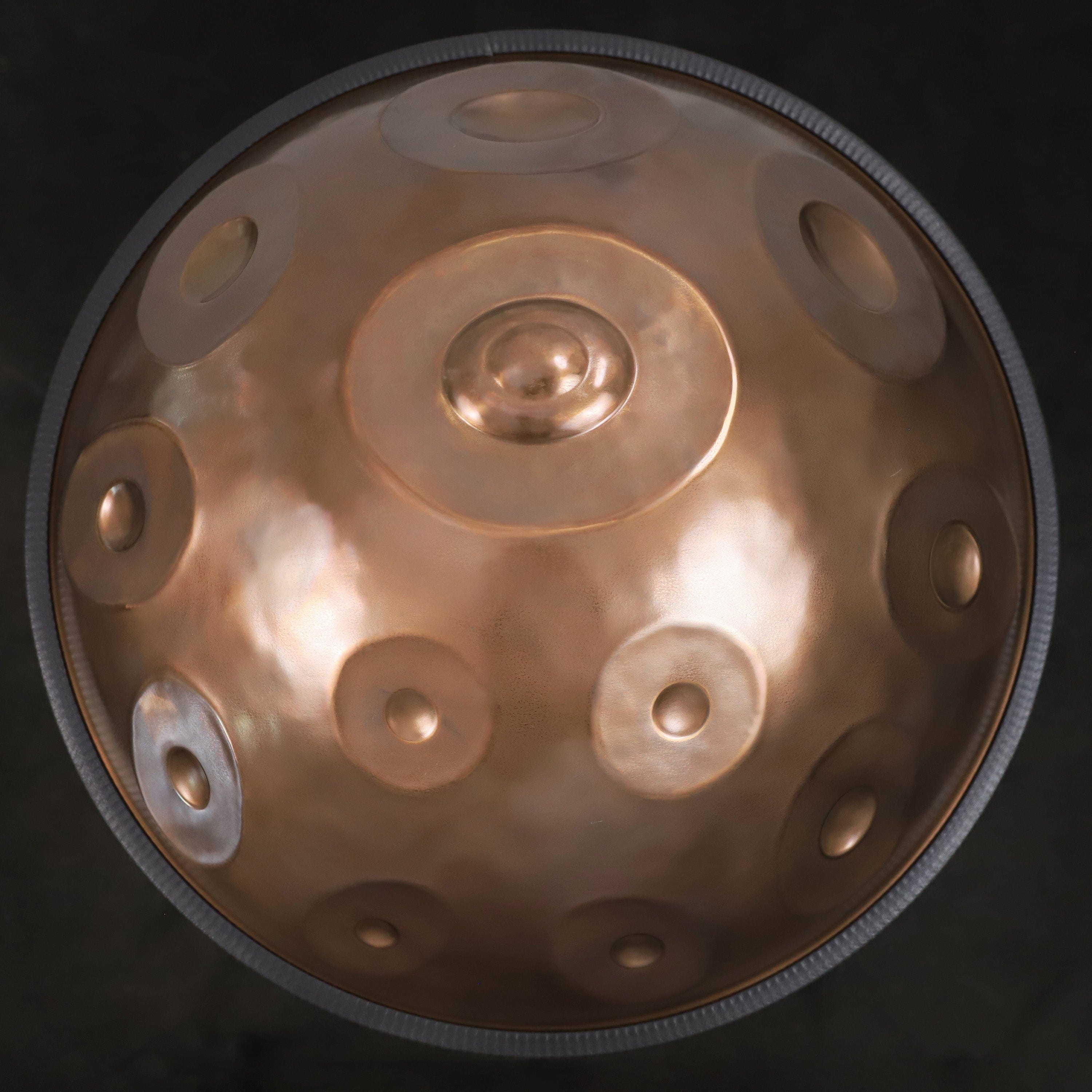 Close-up of the YULA Handpan 14-Note F# Pygmy in matte dark bronze finish, showing its 55cm size and premium craftsmanship.