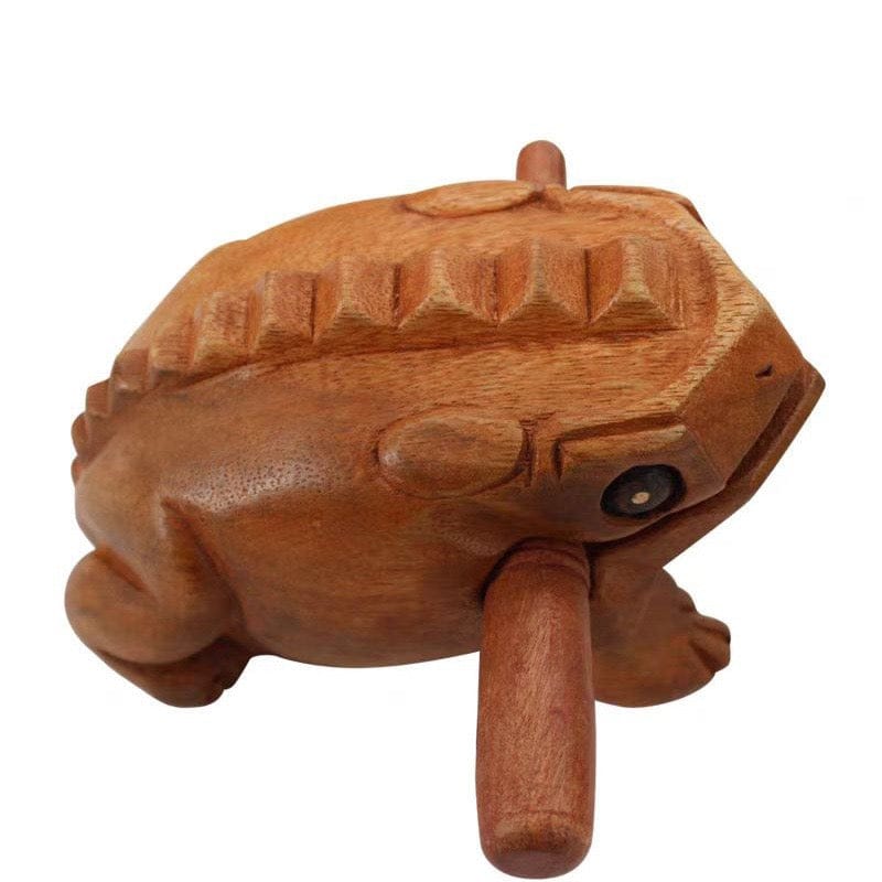 Hand-carved wooden frog percussion instrument with textured back and beater, ideal for rhythm and relaxation