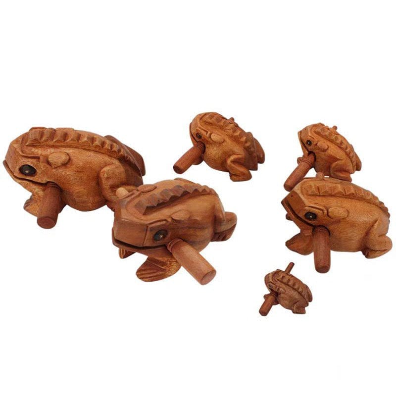Hand-carved wooden frog percussion instruments for rhythmic music and healing sound therapy