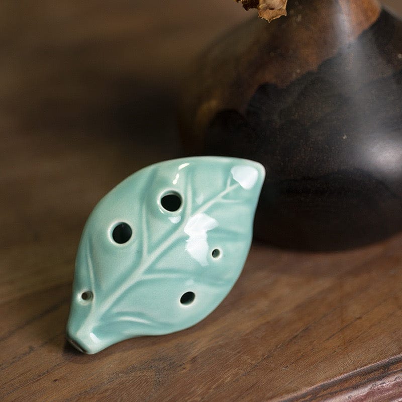 Leaf-shaped ceramic ocarina with nature-inspired design, ideal for healing music and mindful play