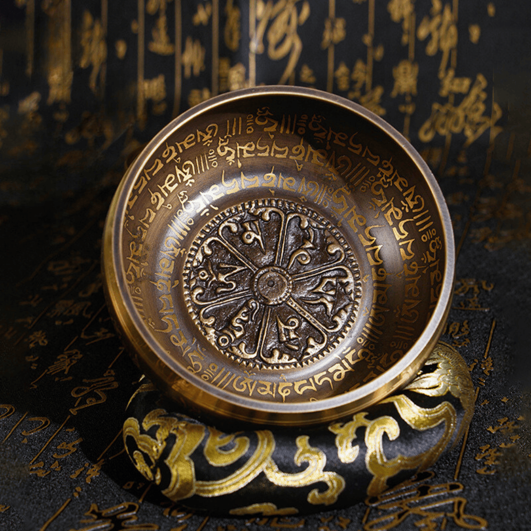 Handcrafted singing bowl with sacred script and ornate design for meditation and healing sound therapy