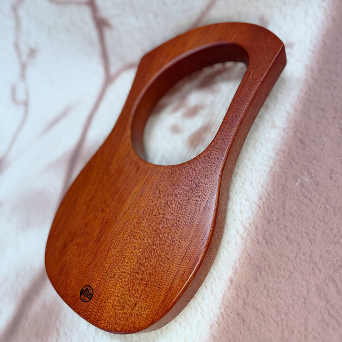 Handcrafted wooden tongue drum with smooth finish and QC Pass stamp, ideal for healing sound therapy.
