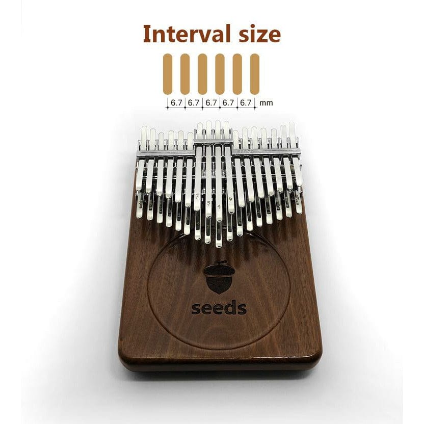 Seeds brand kalimba with 6.7mm interval size, wooden body and metal tines, ideal for healing music