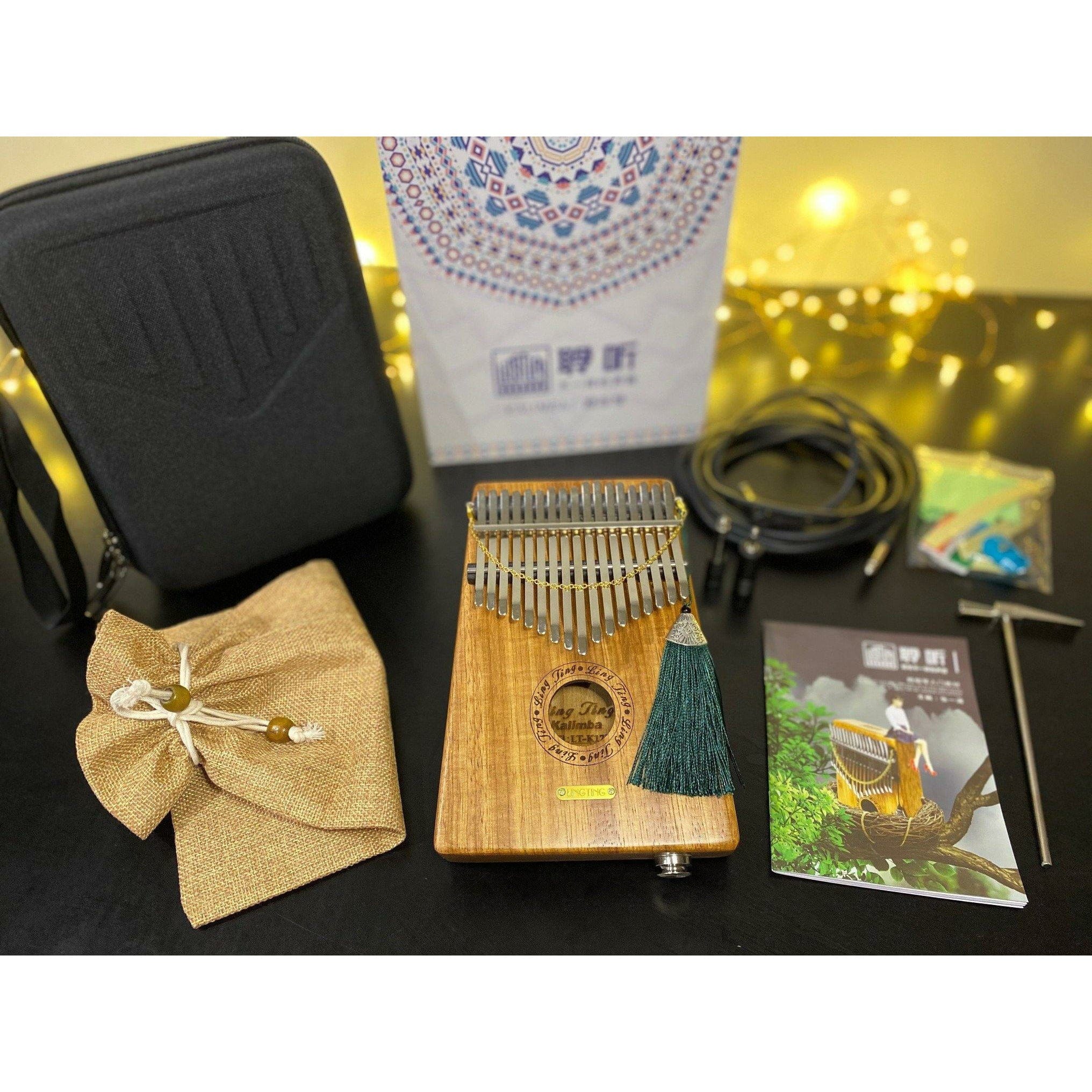 Wooden kalimba with tassel, case, and accessories for healing music and relaxation