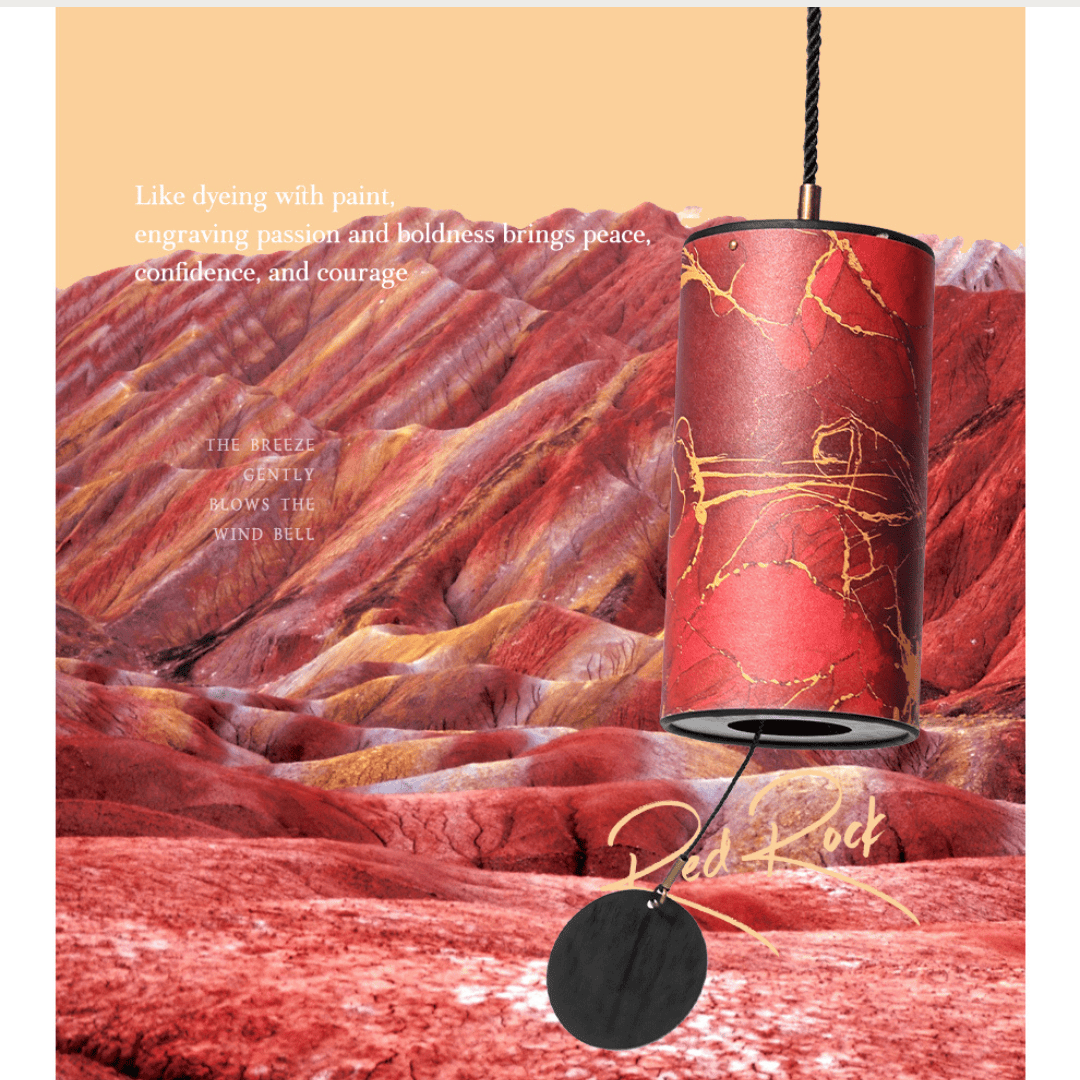 Red Rock wind chime with gold veining, hanging against colorful desert hills, evoking peace and boldness