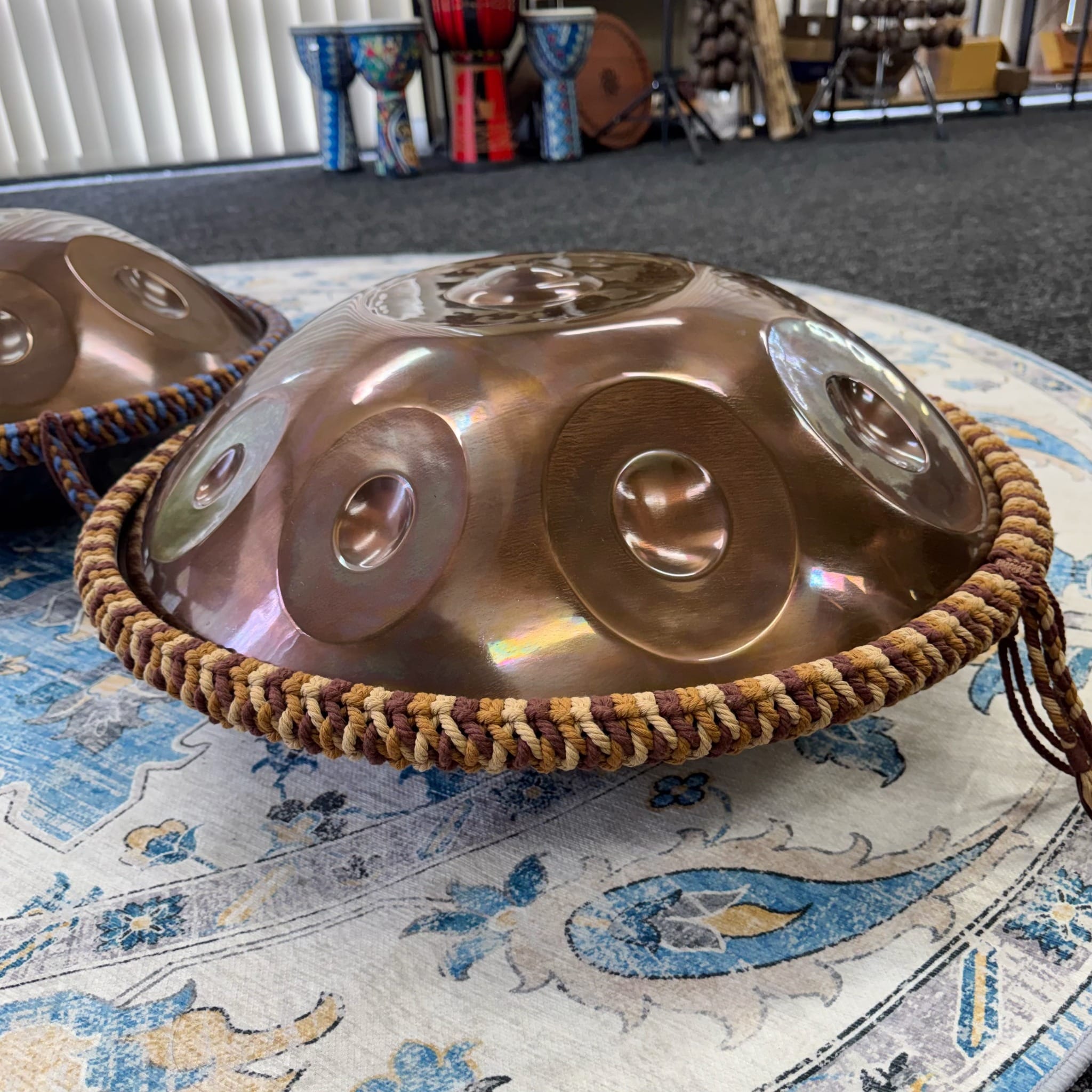 Side view of Harvest adjustable handwoven rim braid fitted to a handpan
