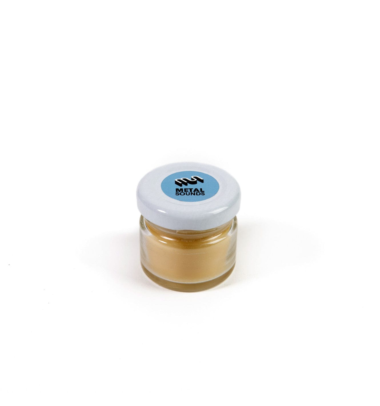 Metal Sounds handpan maintenance wax in small glass jar with blue logo lid
